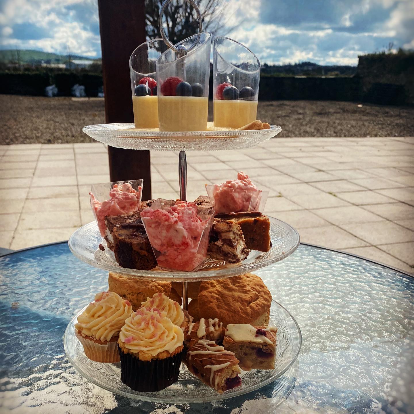Afternoon tea three tier of buns and desserts