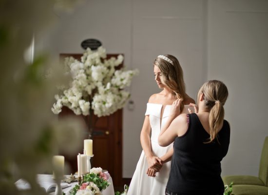 6S2A2066 Patrick bride getting her hair touched up by hair stylist