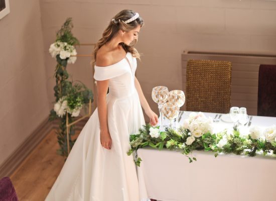 6S2A2278 Patrick bride standing at long table in reception