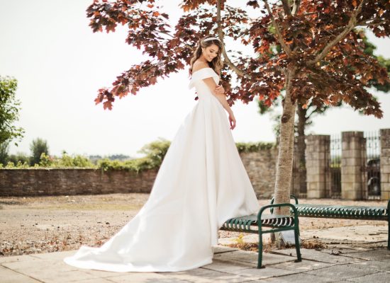 6S2A2383 Patrick bride outdoors on bench in front of tree