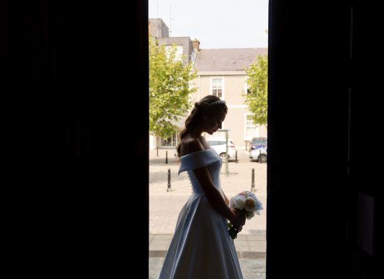 6S2A2792 Patrick dark contrasted image of bride standing in doorway