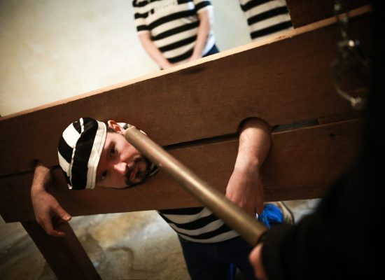LIFFORD COURTHOUSE-87 Patrick prisoner in pillory with a batton facing him