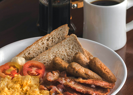 breakfast on plate with coffee