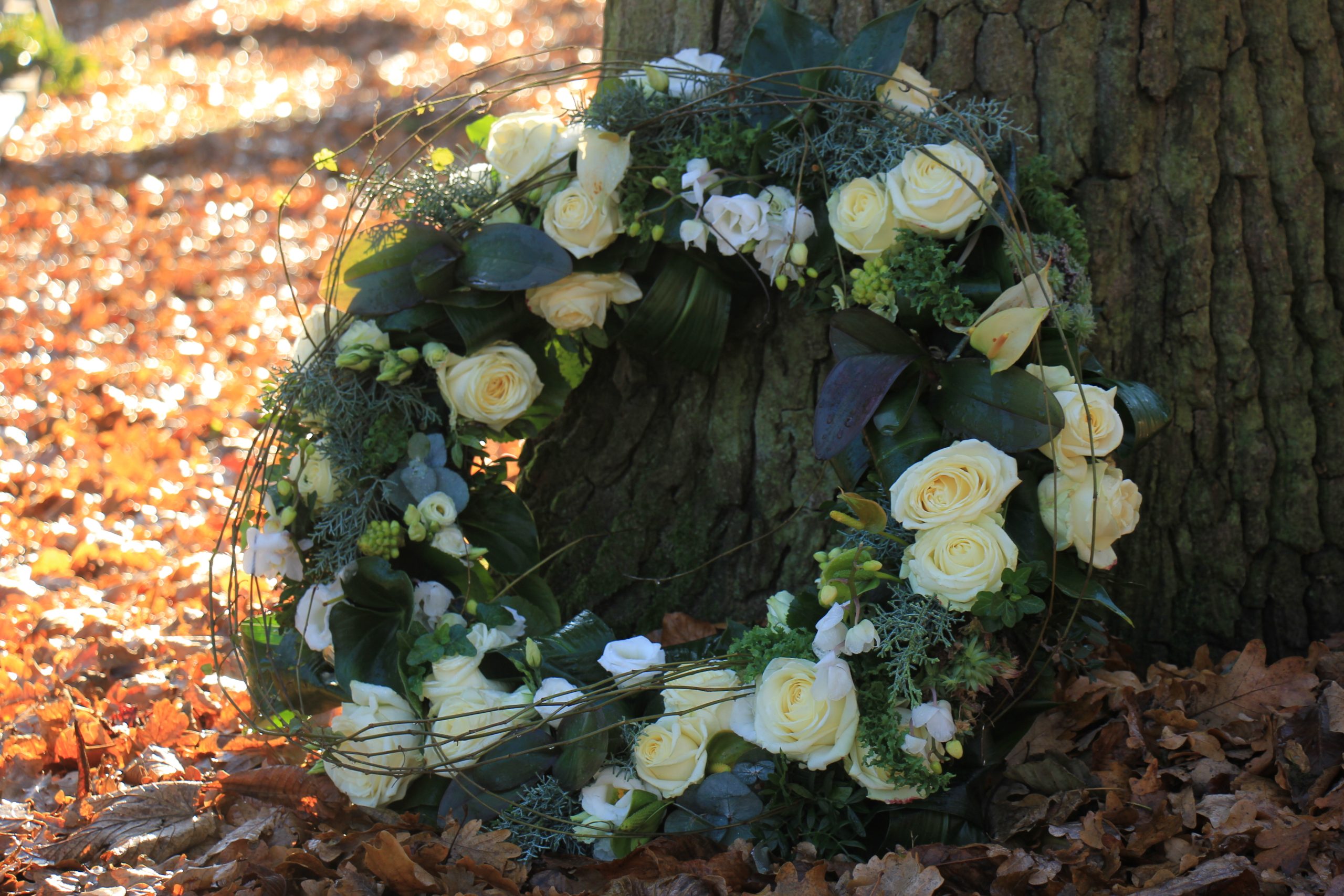 Shaped,Sympathy,Or,Funeral,Flowers,Near,A,Tree,At,A